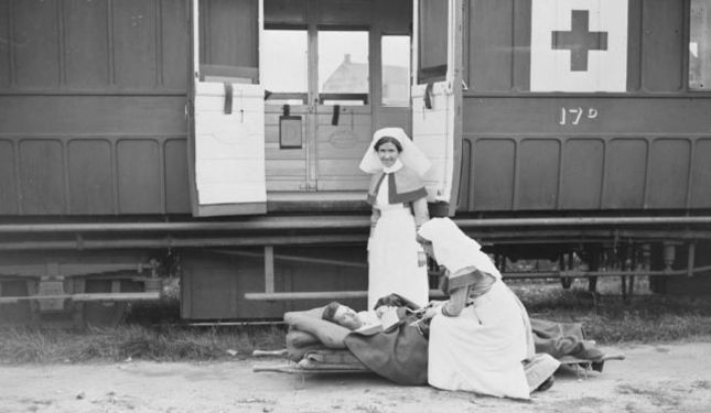 Image of Nursing Sisters with wounded soldier leaving Casualty Clearing Station 1917